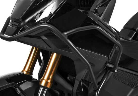Close-up of a motorcycle with gold suspension forks on a white background