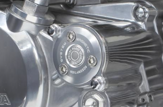 Close-up of a metallic engine component with 'Holley' branding.