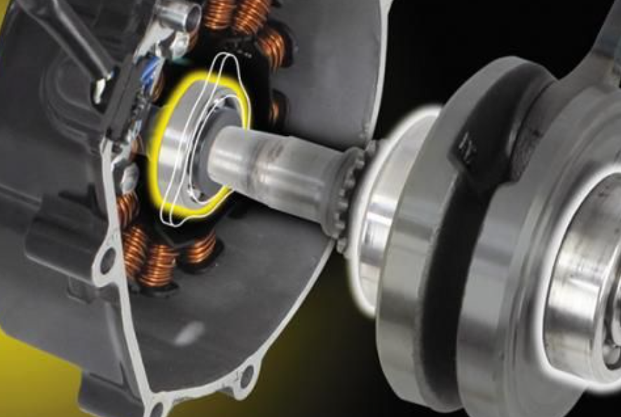 Close-up of a mechanical component with a yellow highlight on a black background