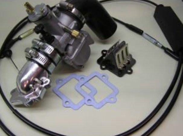Carburetor assembly with gaskets on a light background