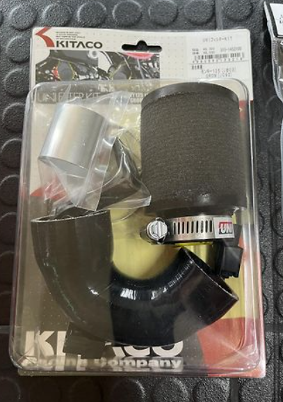 Kitaco motorcycle air filter packaging on a textured black surface