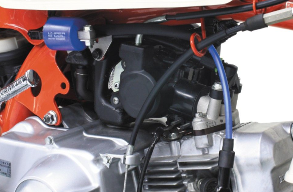 Close-up of a motorcycle engine with visible components and wiring.