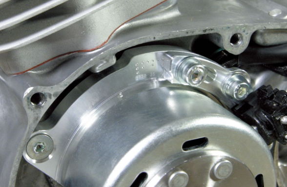 Close-up of a metallic engine component with bolts