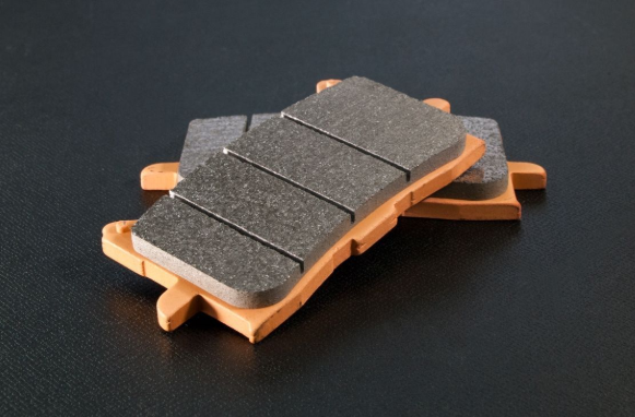 Set of brake pads on a dark background