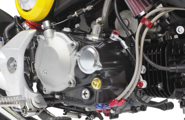 Close-up of a motorcycle engine with visible branding