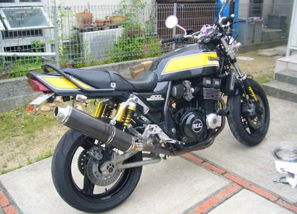 Motorcycle with visible branding on a concrete surface