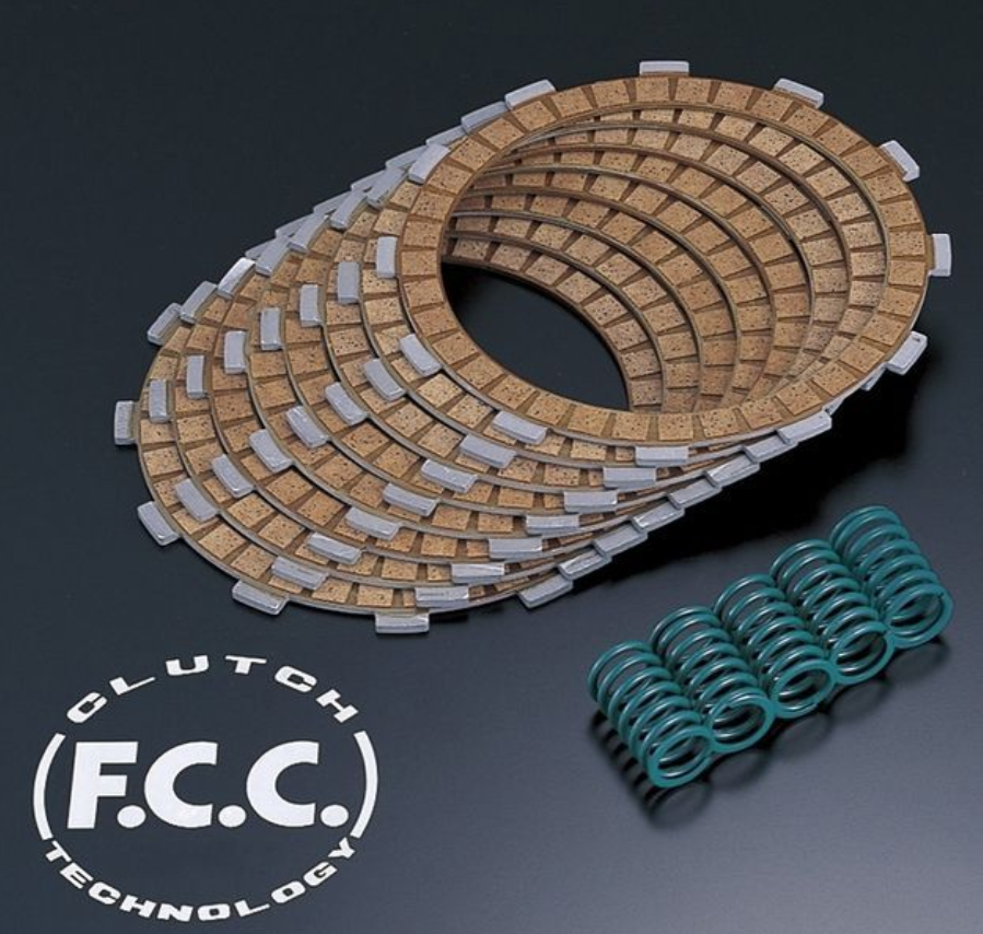 Clutch plates and springs with F.C.C. branding on a dark background