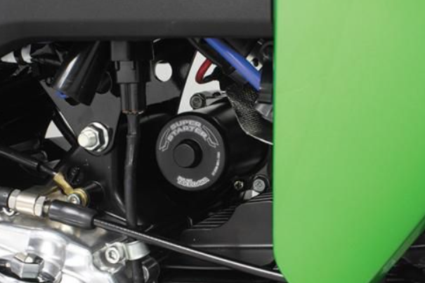 Close-up of a motorcycle engine with a green background