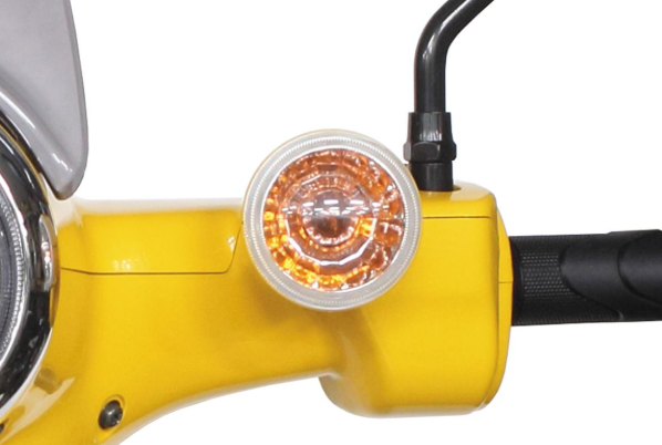 Close-up of a yellow motorcycle handlebar with an orange light