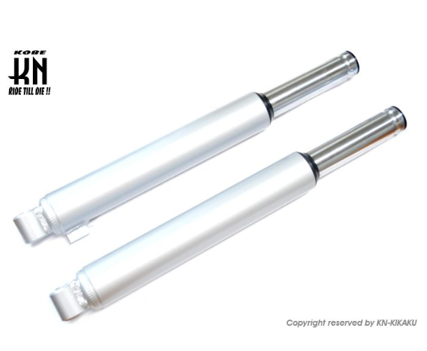 Two white cylindrical objects with silver ends on a white background, featuring the KOKI brand logo.