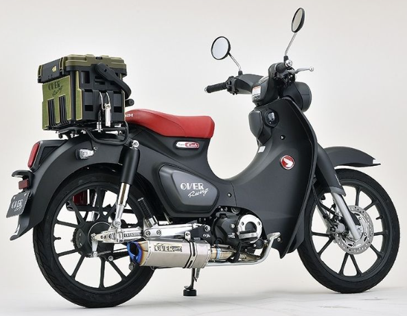 Black scooter with a red seat on a white background