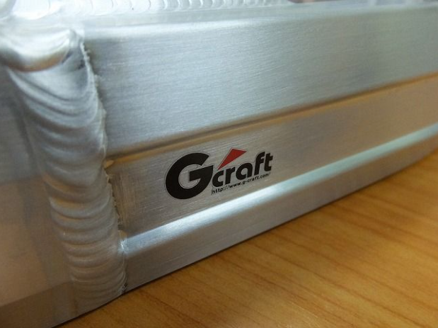 White mattress with Gcraft logo on a wooden floor