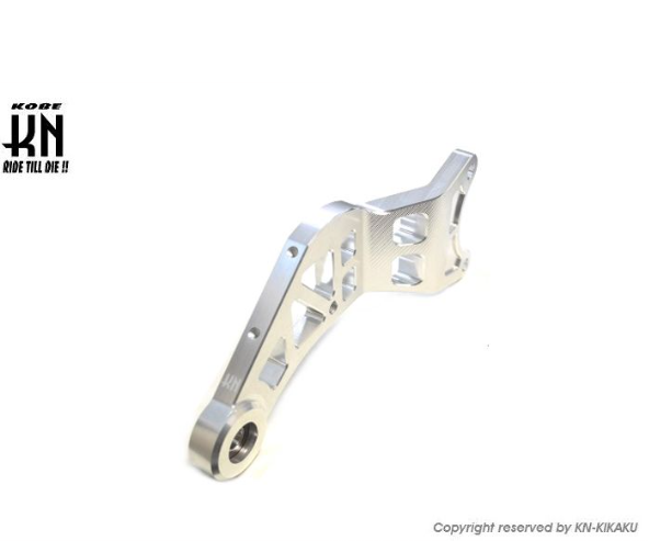 Metallic suspension arm with K&N branding on a white background