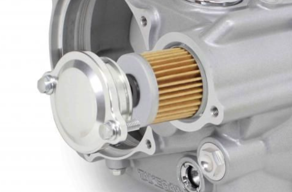 Close-up of a mechanical component with a gold filter on a white background