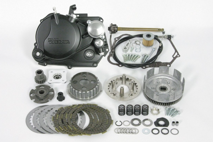 Mechanical parts including gears and bearings on a white background