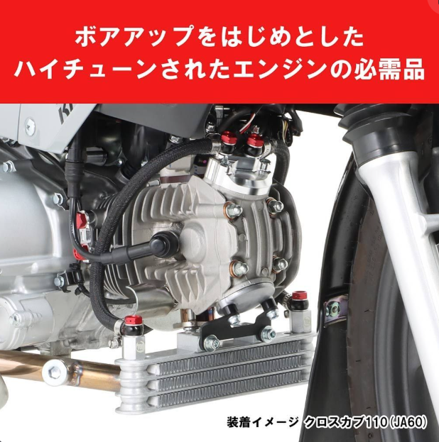 Close-up of a high-tuned engine with visible branding on a white background