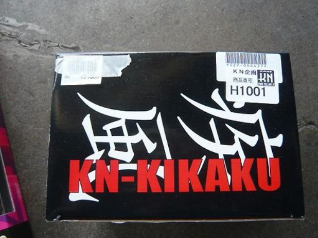Black box with 'KN-KIKAKU' branding on a concrete surface