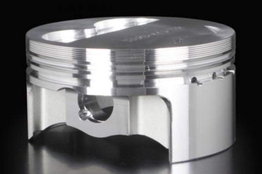 Metallic piston on a black background