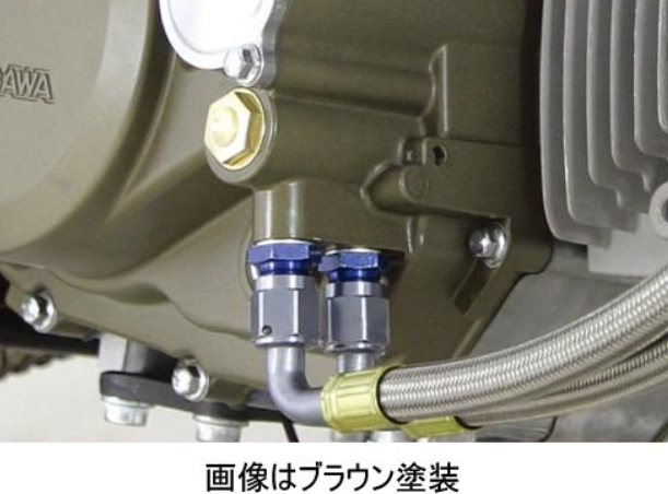Close-up of mechanical components with hoses and connectors on a brown background