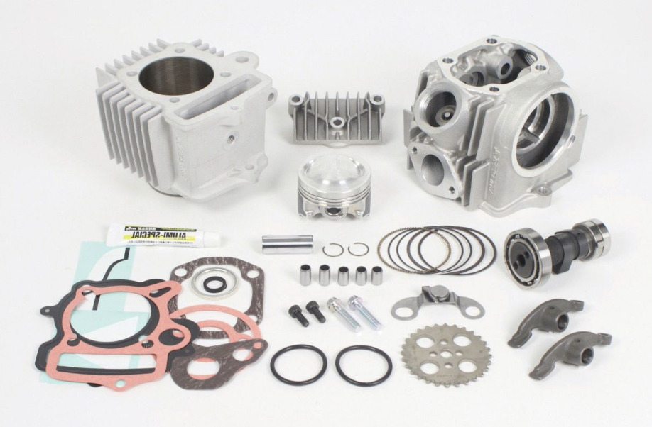 Engine parts including cylinders, gaskets, and bolts on a white background