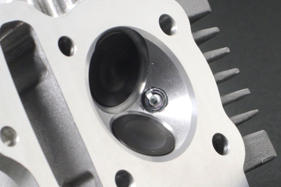 Close-up of a mechanical component with gears and metal parts.