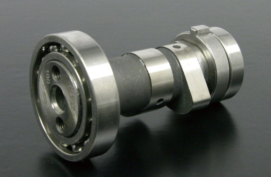 Metal camshaft on a dark gray background