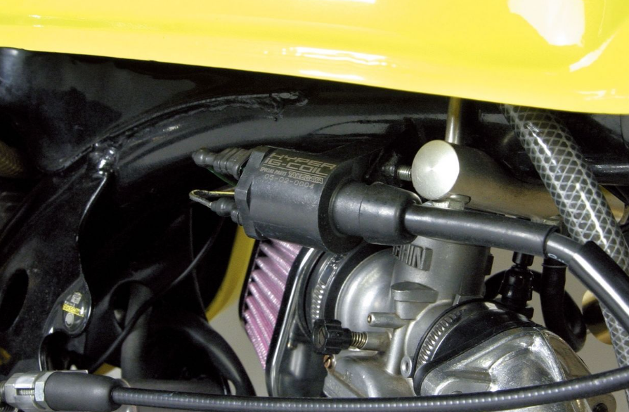 Close-up of a motorcycle engine with a yellow frame