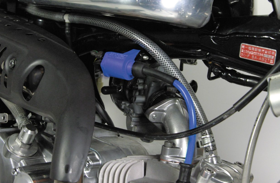 Close-up of a motorcycle engine with visible components and wiring.