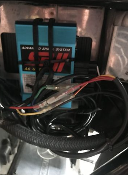 Car stereo system with wiring and 'Advanced Sound System' label.