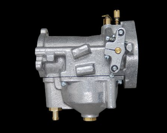 Mechanical component with brass fittings on a black background