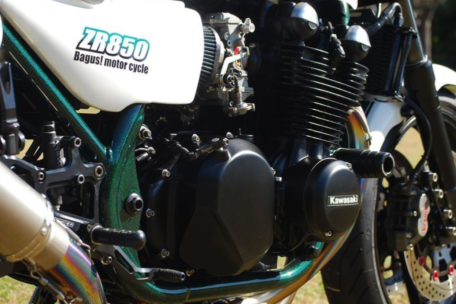Close-up of a Kawasaki motorcycle engine with visible branding.