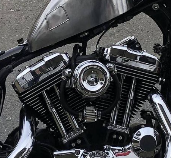 Close-up of a motorcycle engine with a blurred background