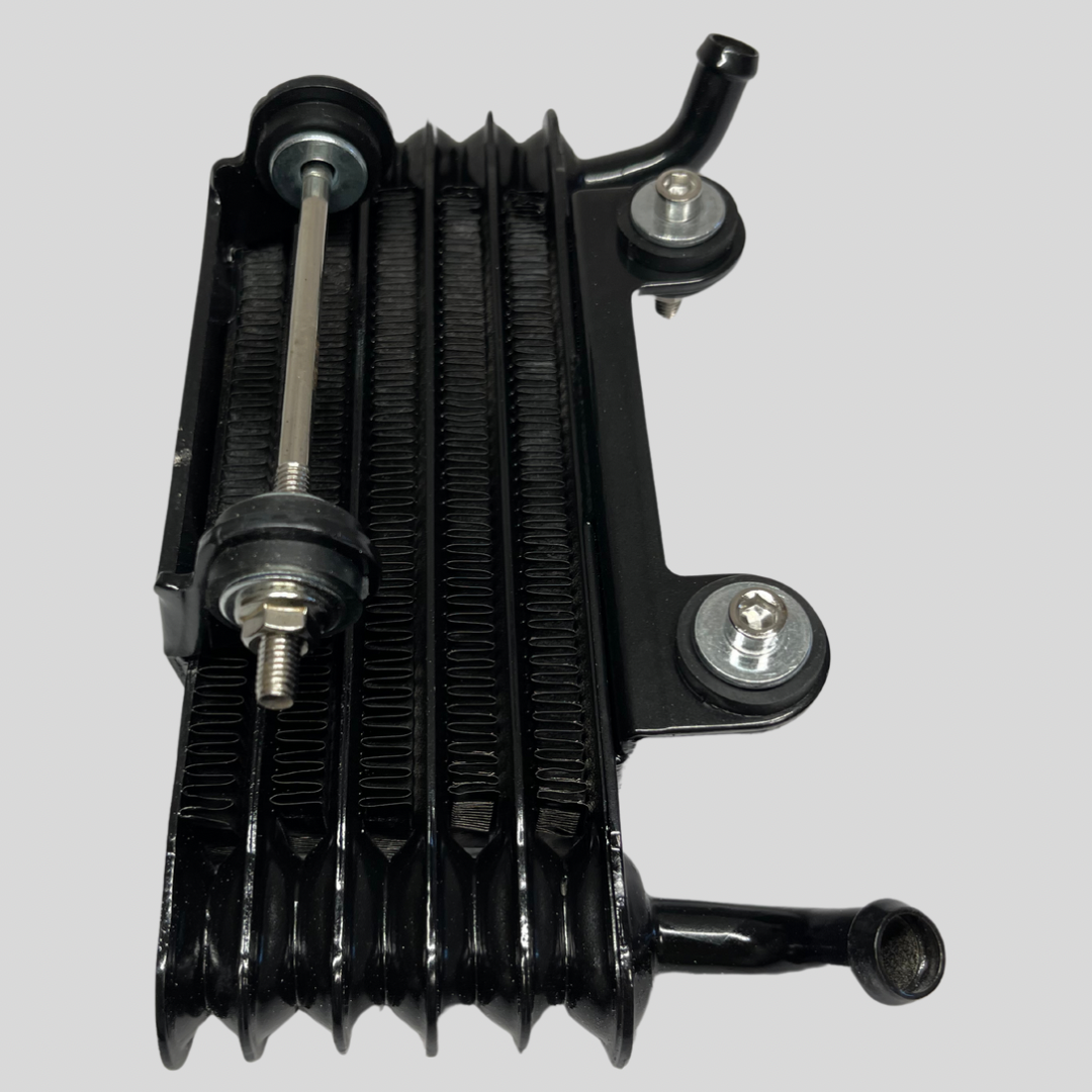 Side view of Z2 Kawasaki OEM Oil Cooler showing mounting hardware and intact cooling fins. Fits Z1, Z2, KZ900, KZ1000, and other classic models.