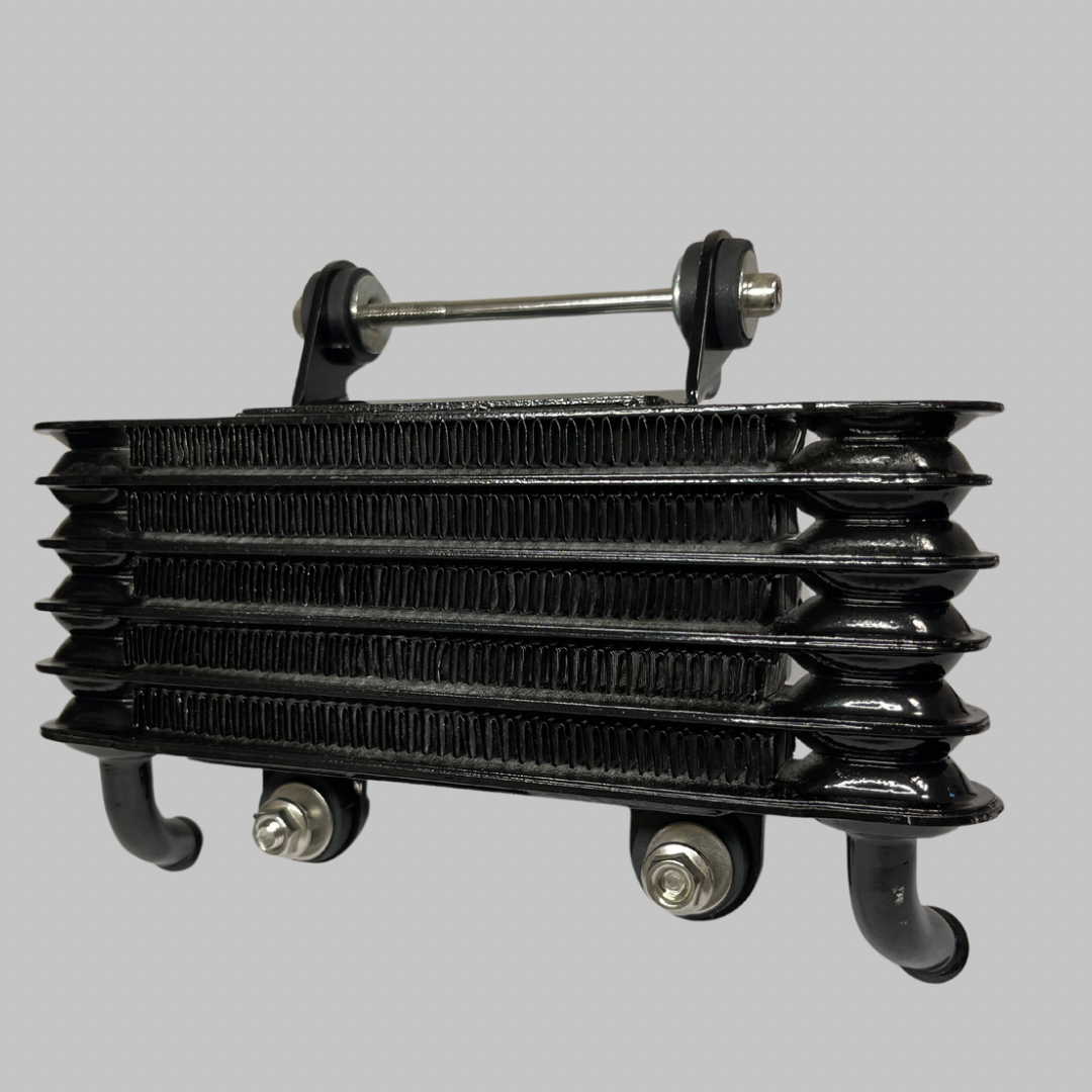 Close-up of black finned oil cooler core for Kawasaki KZ1000 Z1 Z2, showing dual mounting bolts and top stabilizer bar.