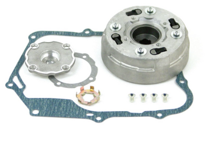 Mechanical components including a clutch plate, gaskets, and bolts on a white background