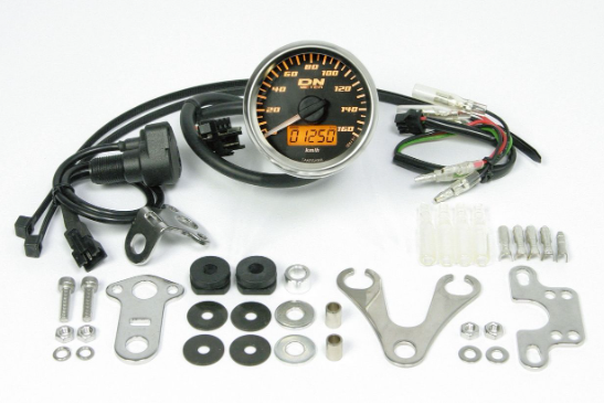 Car gauge kit with various components on a white background