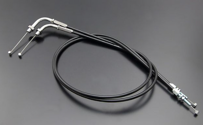 Black motorcycle throttle cable with metal connectors on a gray background