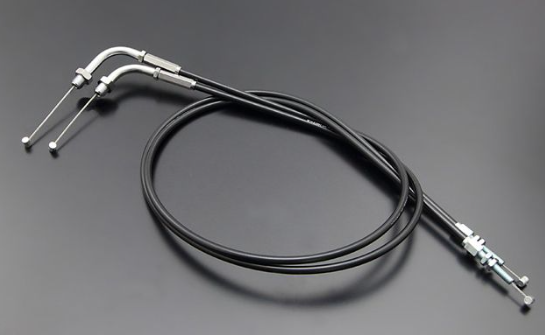 Black motorcycle throttle cable with metal connectors on a gray background