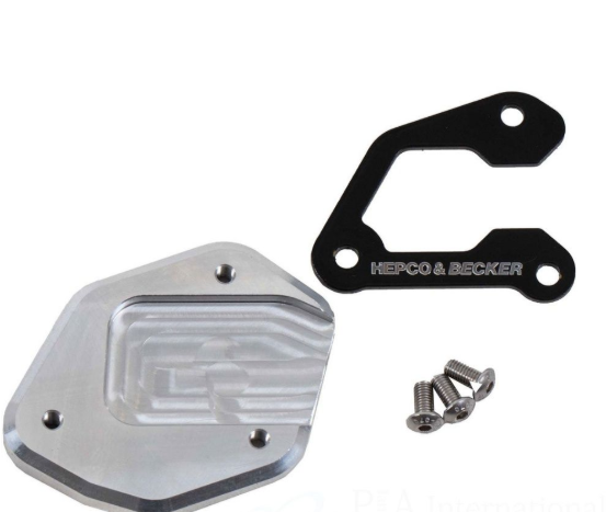 Metallic engine cover with screws and 'Herco & Becker' branding on a white background