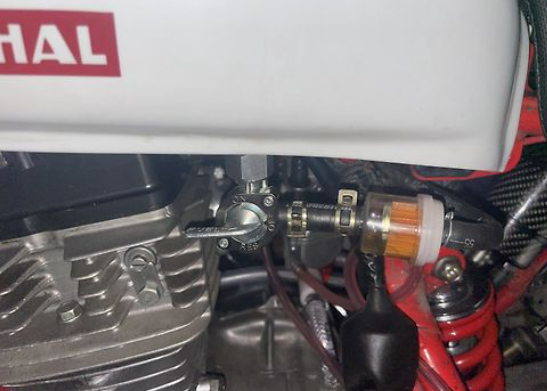 Close-up of a mechanical component with 'Husqvarna' branding on a machine.
