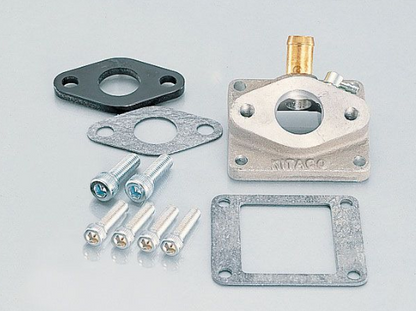 Carburetor kit with parts on a gray background