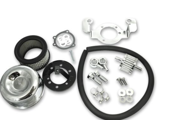 Collection of automotive parts including filters and metal components on a white background
