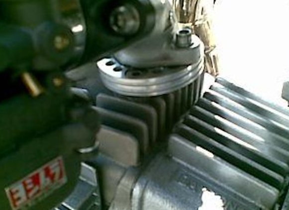 Close-up of a mechanical component with visible branding on a white background