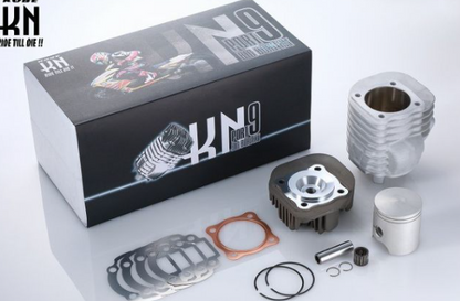 Motorcycle engine parts and KN9 box on a white background