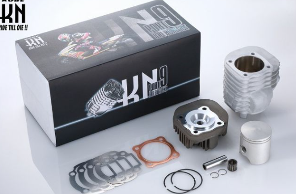 Motorcycle engine parts and KN9 box on a white background