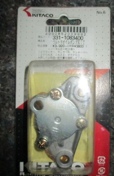 Metal component on a Kitaco branded card with a dark background
