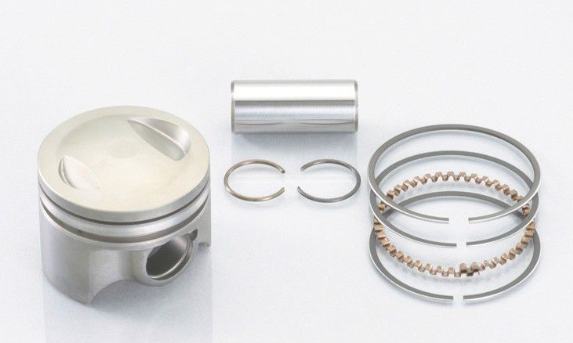 Piston and piston rings set on a white background