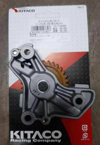 Kitaco motorcycle part on a gray background