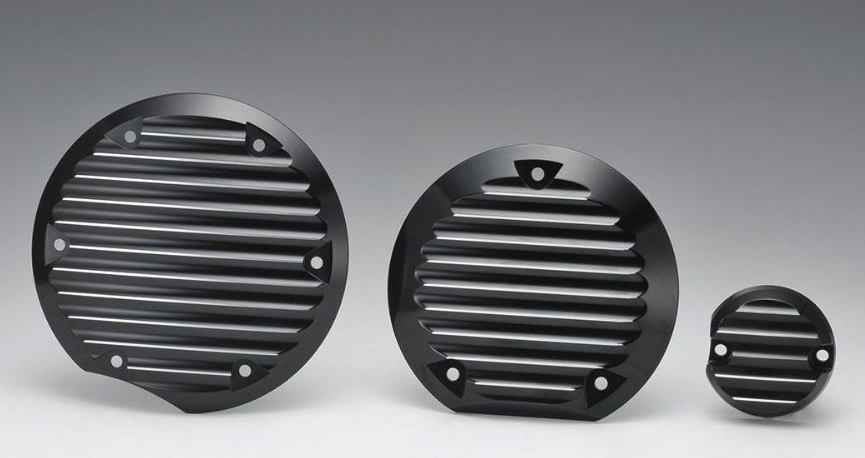Three black metal grilles of different sizes on a gray background