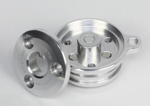Two metallic pulleys on a light gray background